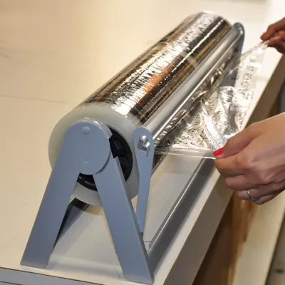 Adhesive floor mat dispenser rack